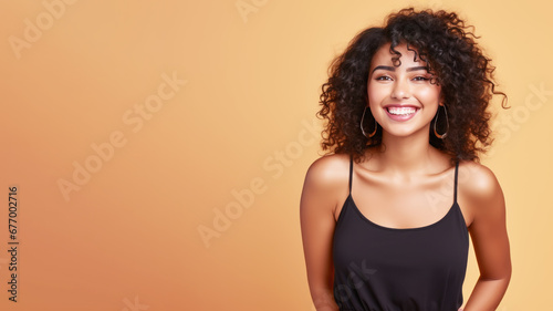 Afro-american woman model wearing a black sundress isolated on pastel