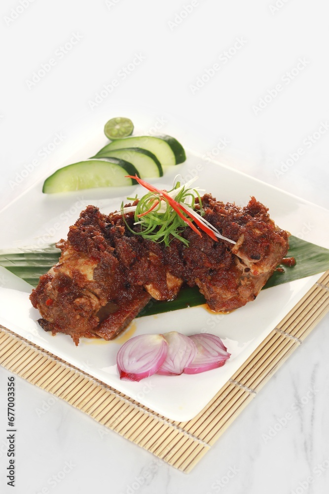delicious Grilled Ribs called Iga Bakar Madu in Indonesian isolated on a white background