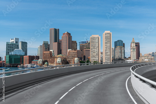 Empty urban asphalt road exterior with city buildings background. New modern highway concrete construction. Concept of way to success. Transportation logistic industry fast delivery. Boston. USA.