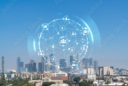 Los Angeles panorama skyline of downtown at day time, California, USA. Skyscrapers of LA city. Glowing Social media icons. The concept of networking and establishing new connections between people