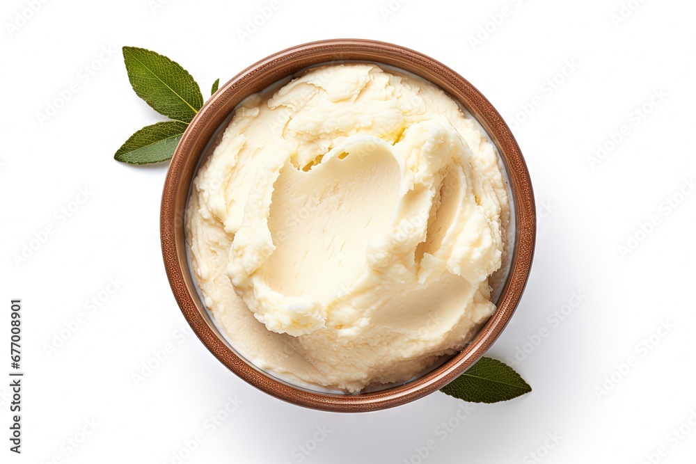 Top view of a bowl with isolated shea butter on a white background - obrazy, fototapety, plakaty 
