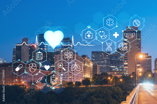 Panoramic view of Broadway district of Nashville over Cumberland River at illuminated night skyline, Tennessee, USA. Hologram healthcare digital medicine icons. The concept of treatment from disease photo