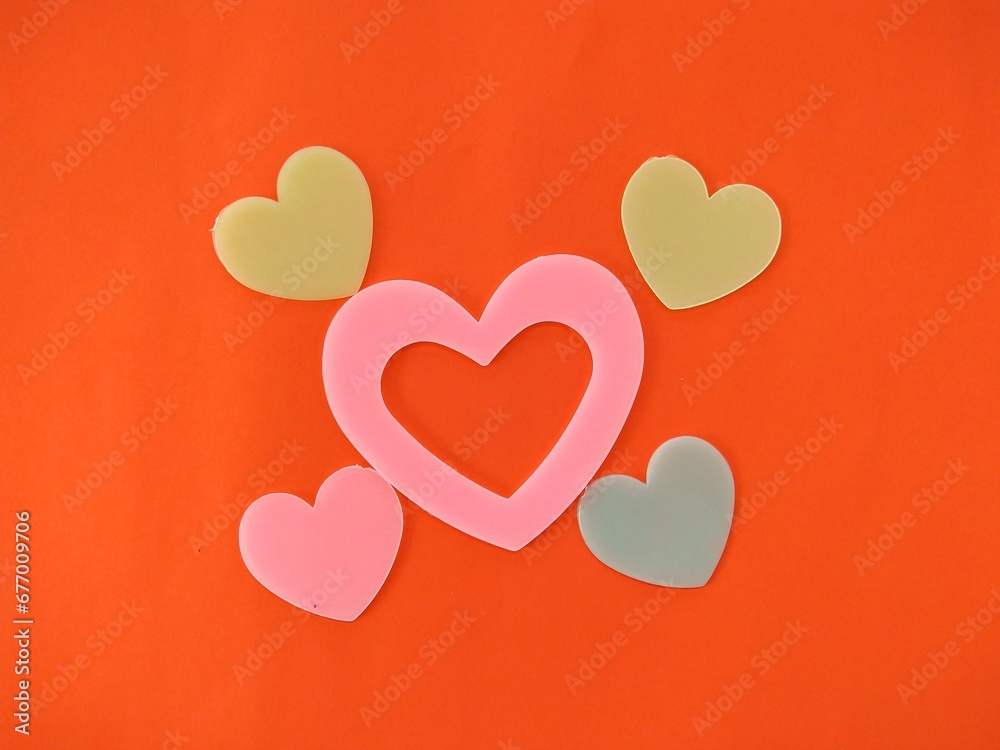 Big heart surrounded by many small hearts isolated on red background for Valentine's Day. Big heart surrounded by many small hearts isolated on red background for Valentine's Day.