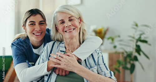 Senior care, old woman in wheelchair and nurse hug, support and smile with healthcare advice in home. Homecare, elderly patient and happy caregiver in living room for consultation, help and kindness. photo