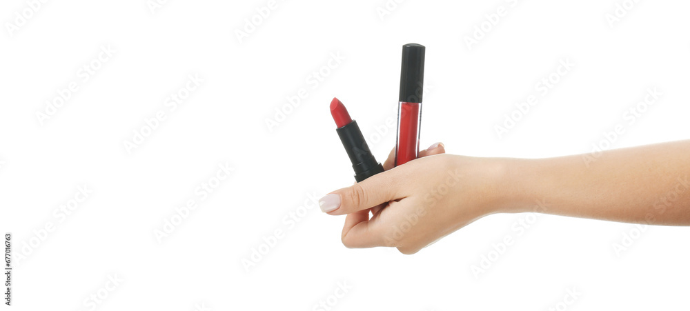 Hand holding lip gloss and lipstick on white background Hand holding lip gloss and lipstick on white background