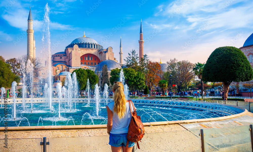 Fototapeta premium Woman looking at Hagia Sophia grand mosque, Istanbul in Turkey