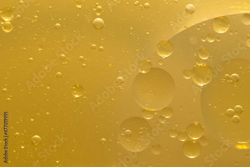 Oil bubble texture on gold background.