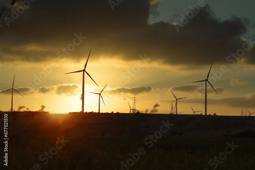 wind turbines with beautiful sunset sky, zorlu energy wind turbines installed in jhampir near gharo sindh Pakistan. renewable energy, green energy