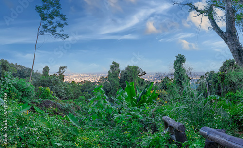 Panorama view of Chiangmai Chiang Mai city taken from Doi Suthep Mountains. Lovely views of the Old city at Sunset Sunrise lovely tropical mountains and beautiful nature in the foreground