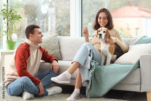 Young couple with cute Beag...