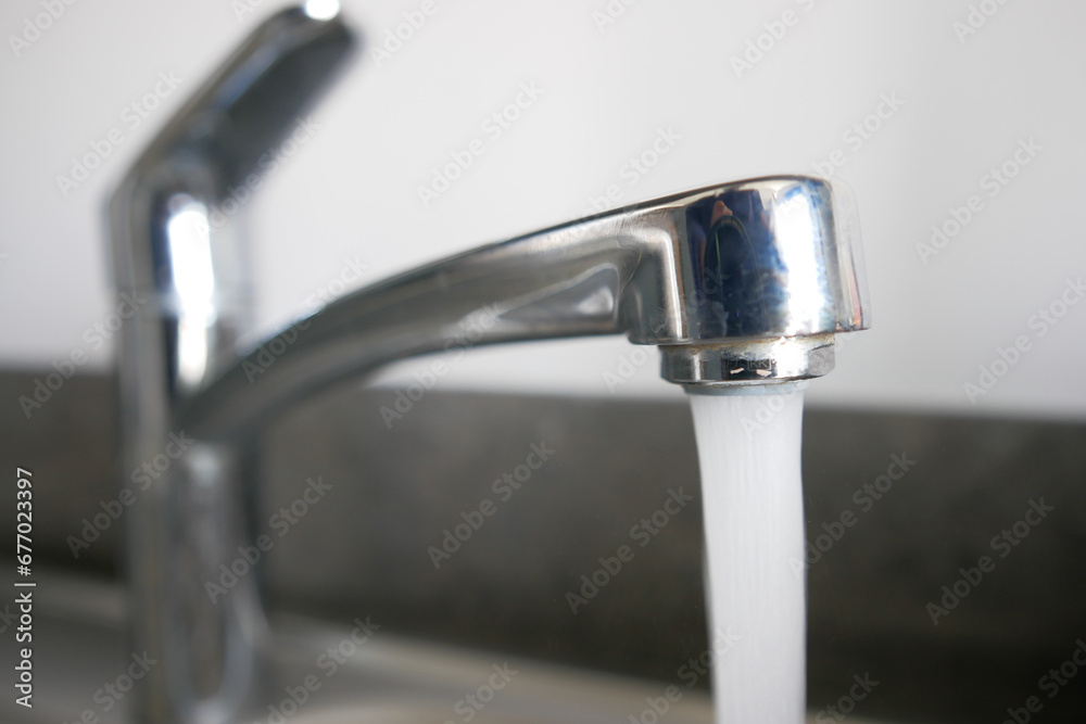 water pouring from a faucet tap slow motion water pouring from a faucet tap slow motion