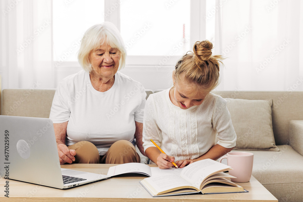 Laptop togetherness selfie child granddaughter hugging family bonding smiling grandmother