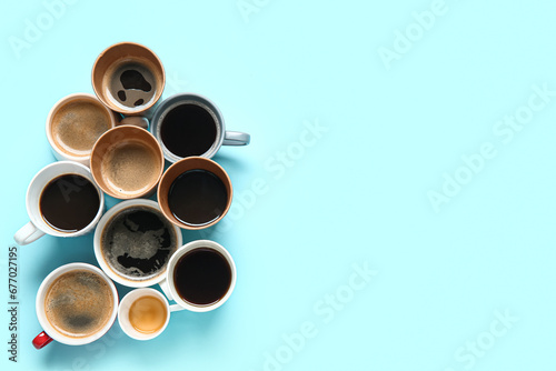 Many cups of hot coffee on blue background