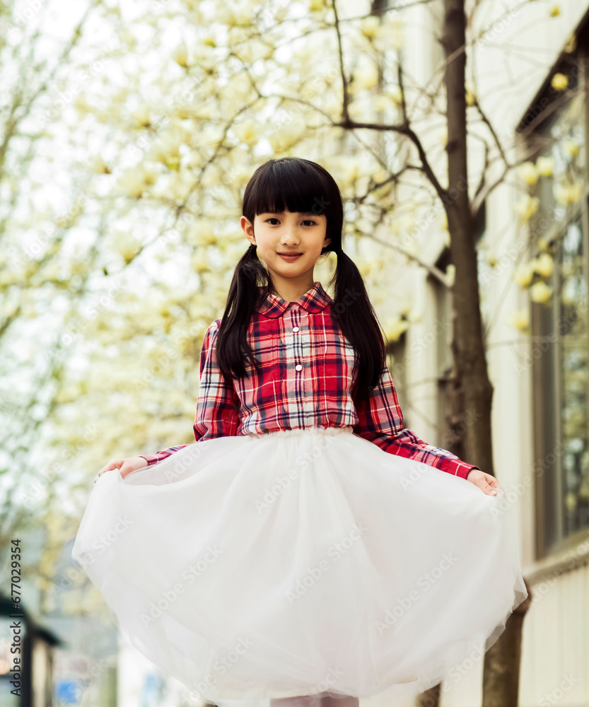 Fototapeta premium girl in a cherry blossom