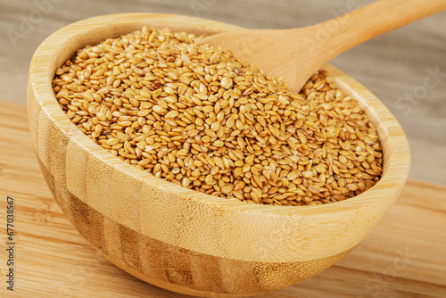 Wooden bowl filled with healthy and delicious Roasted Flax Seeds