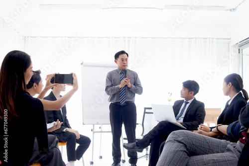 Quadro em tela Businesspeople discussing at conference, senior businessman speaker lecturing presentation at group board meeting