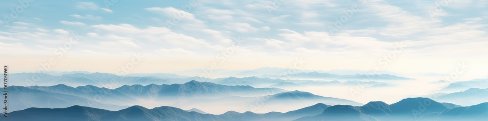 A Majestic Landscape: Painted Peaks and Ethereal Clouds