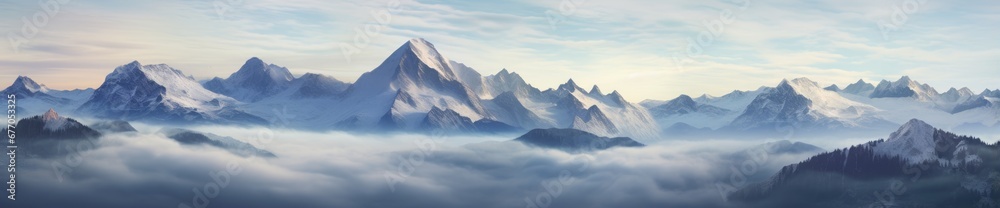 A Majestic Landscape: Mountain Peaks Emerging from Clouds in a Scenic Masterpiece