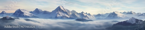 A Majestic Landscape: Mountain Peaks Emerging from Clouds in a Scenic Masterpiece
