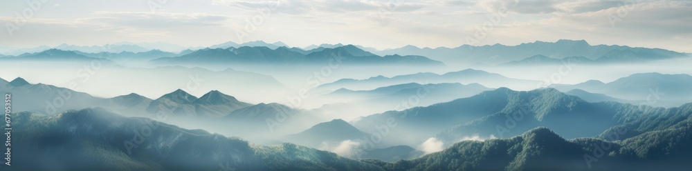 Majestic Peaks Shrouded in Mystical Mist