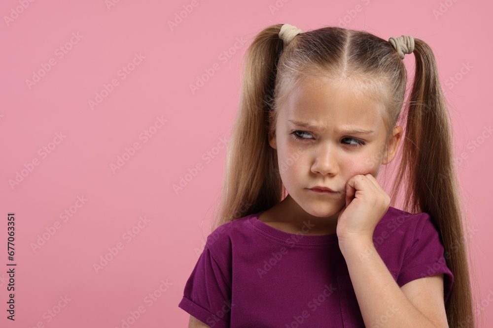 Resentful girl on pink background. Space for text Resentful girl on pink background. Space for text