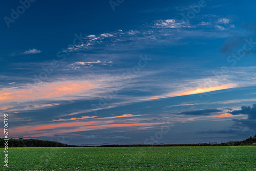 blue and orange sunset over green field in Worcestershire countryside