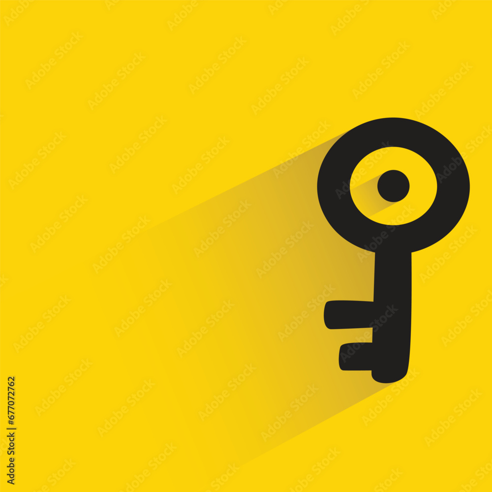 key with shadow on yellow background key with shadow on yellow background