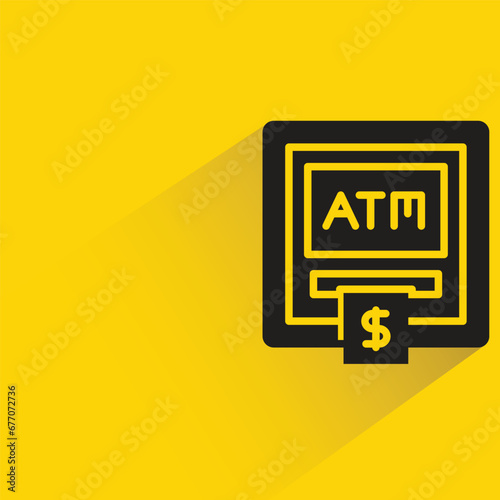 atm with shadow on yellow background