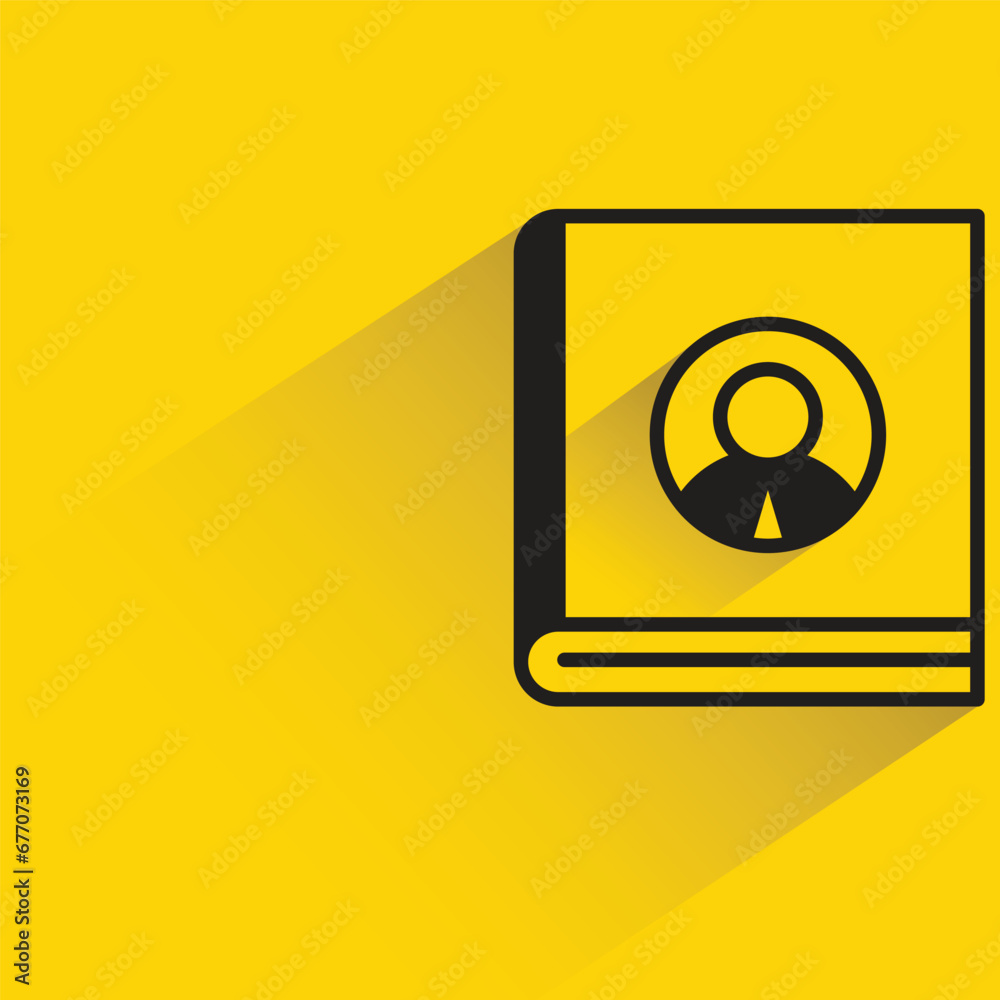 contact book with shadow on yellow background contact book with shadow on yellow background