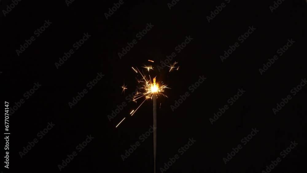 4K real sparkler. burning sparkler isolated on chroma key black background for overlay motion graphic.