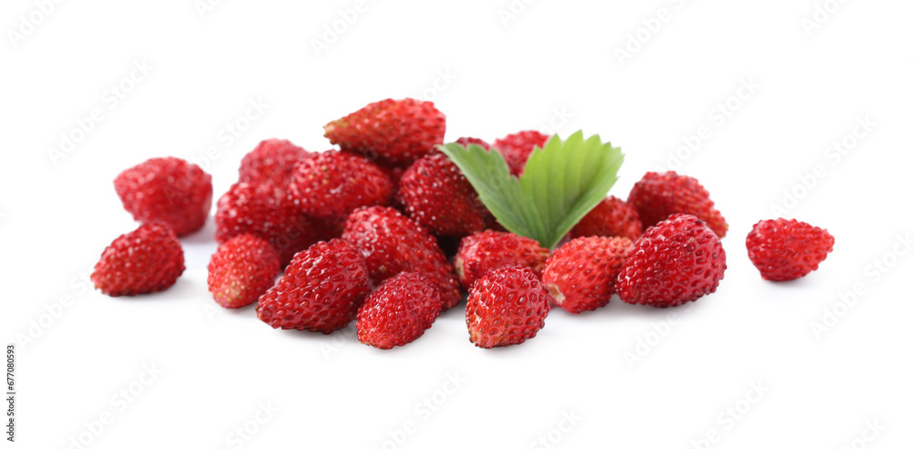 Ripe wild strawberries and green leaves isolated on white Ripe wild strawberries and green leaves isolated on white