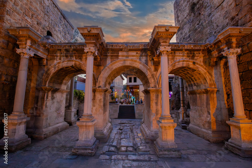Sunset at the historical Hadrian's Gate, Antalya, Türkiye.