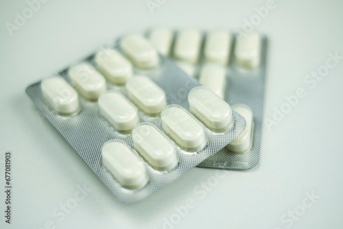 detail of several blister packs of antibiotic pills