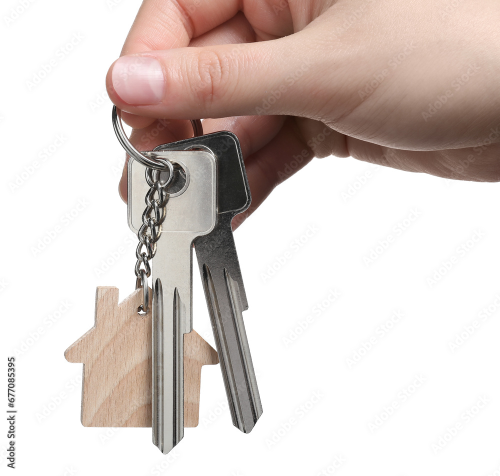 Woman holding keys with keychain in shape of house isolated on white, closeup Woman holding keys with keychain in shape of house isolated on white, closeup