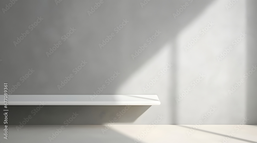 Minimal abstract light gray background for product presentation. Shadow and light from windows on plaster wall. Minimal abstract light gray background for product presentation. Shadow and light from windows on plaster wall.