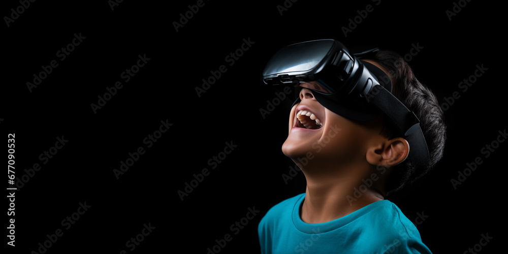 Young boy getting experience using VR headset glasses isolated on a black background with copy space Young boy getting experience using VR headset glasses isolated on a black background with copy space