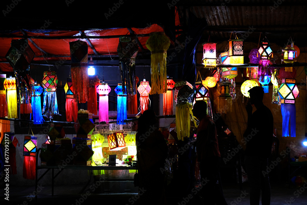 Fototapeta premium Hanging Diwali Lamp (Kandil) - Diwali Festival Background, Colourful lanterns made by paper eco friendly material akashkandil hang shop sell celebrating diwali festival in Pune, Maharashtra, India.