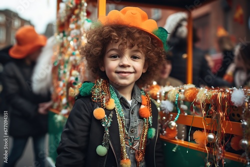 Cheerful boy wearing green clothes participating in Saint Patrick's Day parade in Irish town. © Marcela Ruty Romero