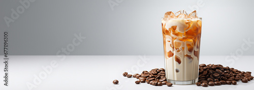 Latte coffee with milk on white background. cold brewed iced latte coffee, showing separate in a layer the bottom as milk top by coffee shot in a plastic glass. isolated white background Copy space