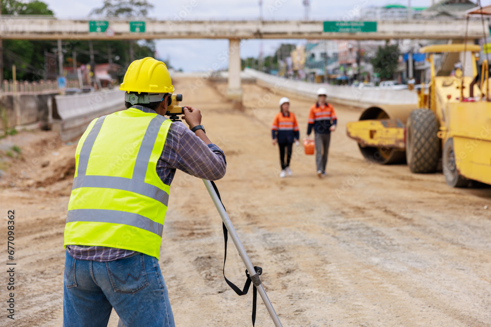 Engineer use theodolite equipment for route surveying to build a bridge Engineer use theodolite equipment for route surveying to build a bridge