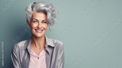 Charming woman with silver hair and a beaming smile in a blazer