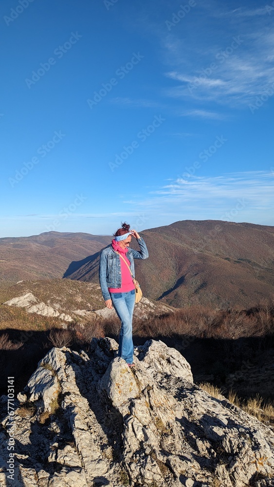 A girl is photographed on a rock high in the mountains. Travel blog A girl is photographed on a rock high in the mountains. Travel blog