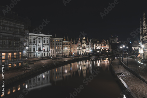Medieval buildings on Graslei Street in the centre of Ghent by the River Leie during the night. Belgium's most famous historical centre. Ghent waterfront during midnight © Fauren