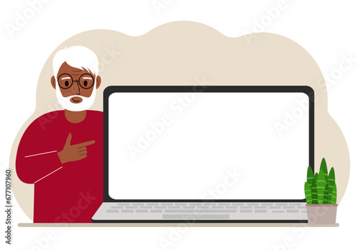 A man next to a large laptop with plenty of space for text.