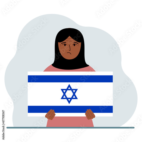 A woman holds the flag of Israel in his hands. The concept of demonstration, national holiday or patriotism. Nationality.