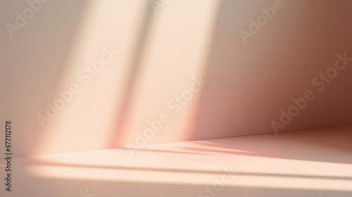 Background image of an empty space in pink pastel tones with a play of light and shadow on the wall and floor