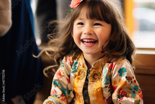 laughing little girl in custom embroidered jacket