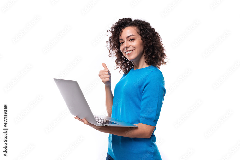 young successful leader woman showing like gesture and holding laptop in her hands young successful leader woman showing like gesture and holding laptop in her hands