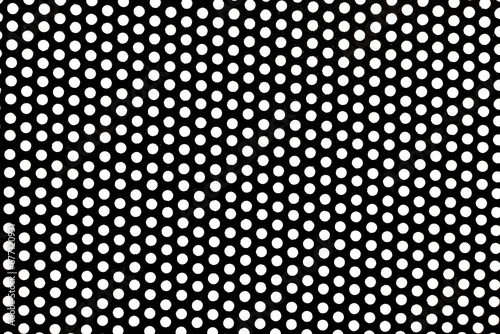 Texture of metal black mesh with round holes on a white background. Background made of metal perforated mesh photo