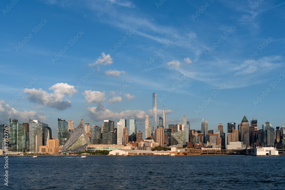 New York west side and panoramic view on skyline under sky with clouds sunset
